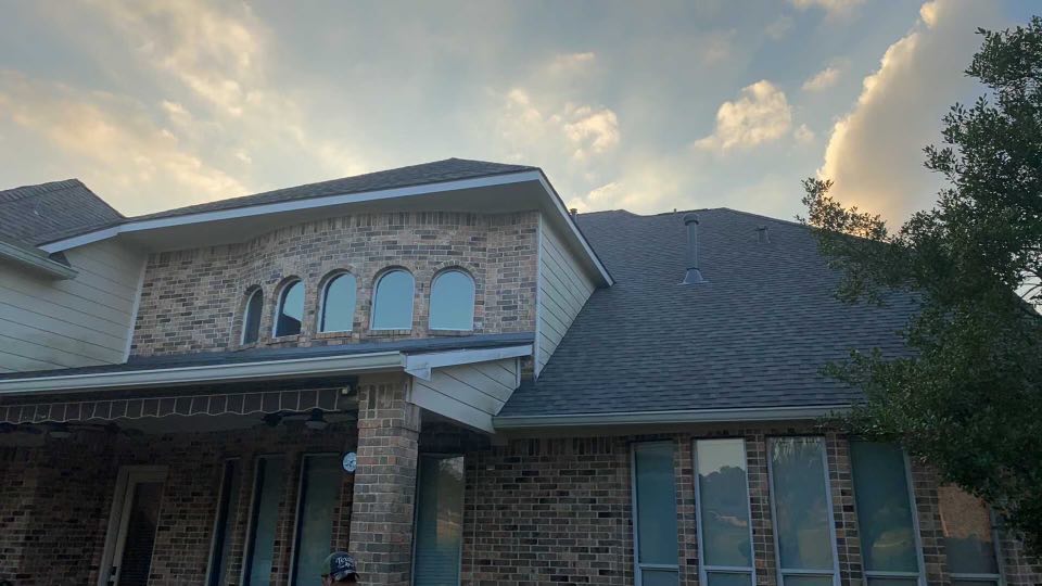 Completed residential roofing project by Houston Strong Roofing showing professional installation and quality workmanship