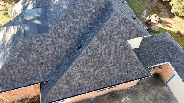 Drone view of a repaired roof on a one-story Houston home in 77088