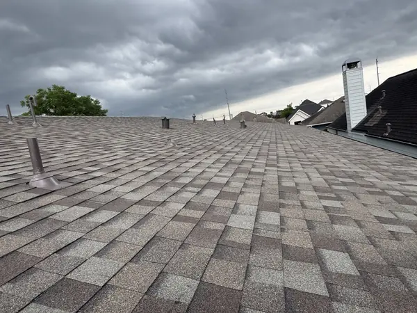 Roof field with new pipe jacks after shingle replacement