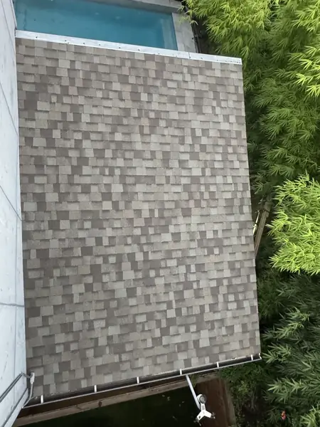 Top-down view of a lower roof section with a new box vent