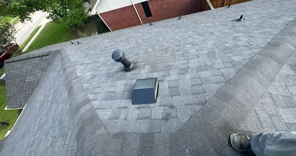 New roof vent and hip ridge on a brick house in northwest Houston