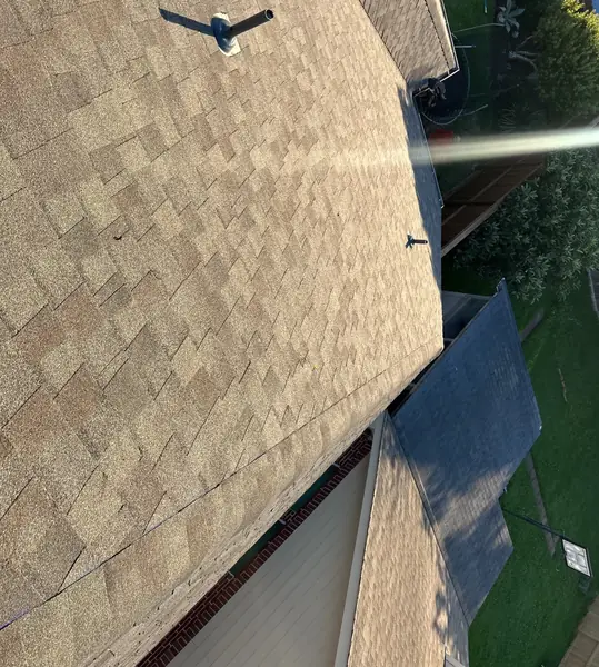 Side slope of a windstorm-nailed roof in League City 77573
