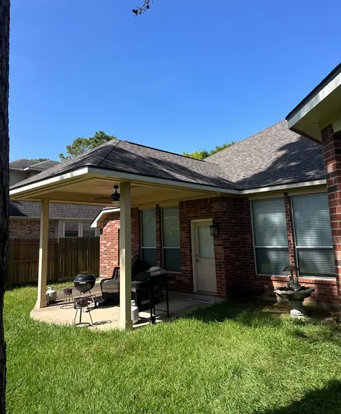 Back patio and roofline after the replacement