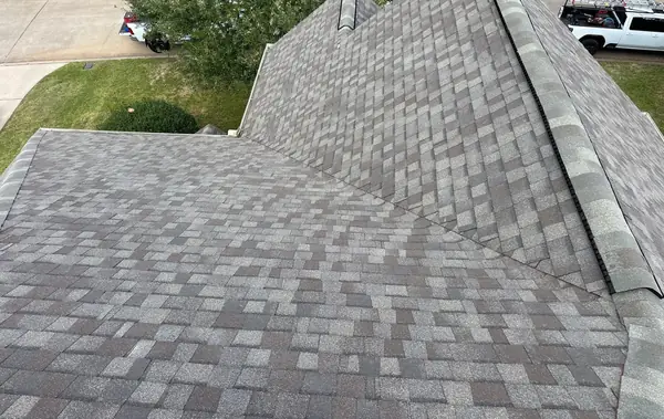 Replaced architectural shingle roof with capped hips on a Houston home in 77040