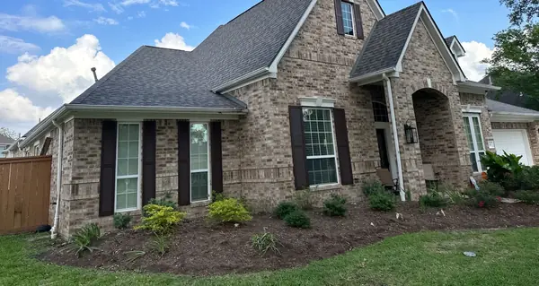 One-story stone-front Pearland home with a new CertainTeed 5-Star roof