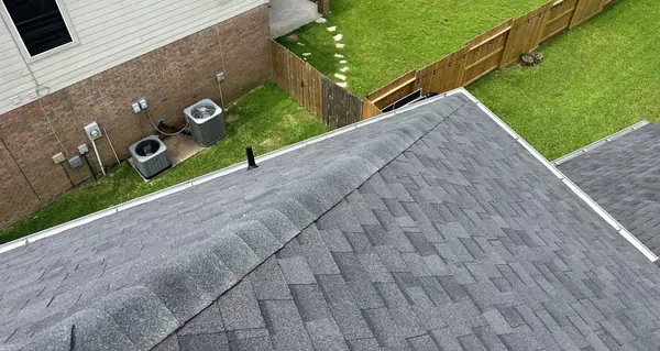 Roof edge over the side yard on a replaced Houston roof