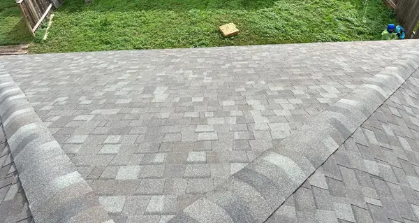 Shingle field and hip caps on the finished roof