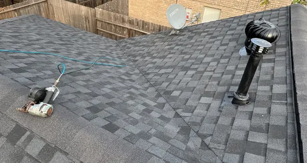Turbine vent and pipe boots on a replaced roof in Houston's Bear Creek area
