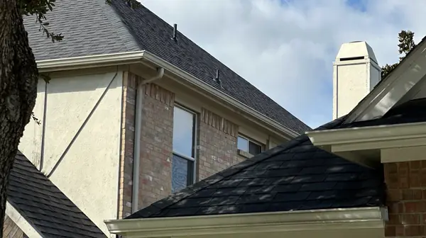 Steep upper gable and chimney after replacement