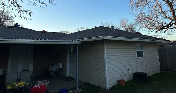 Rear of a Channelview home with a new roof over the patio