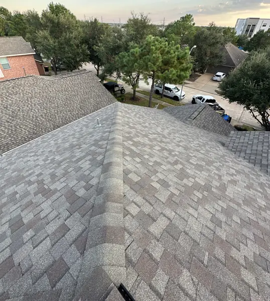 Main hip of a new Weathered Wood roof in Bridgeland, Cypress