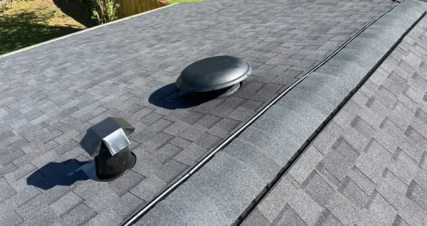 New gray laminate roof with dome vents on a one-story La Porte home in 77571