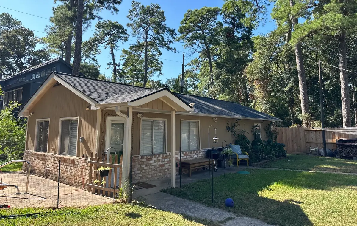 Front of the one-story home with the completed roof