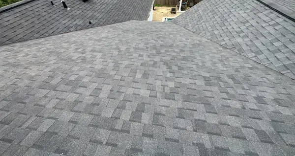 Shingle field and ridge caps on the main slope