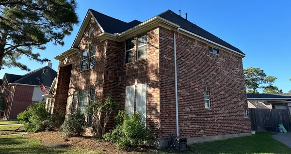 Side elevation showing the gable and new black shingles, Cypress 77433
