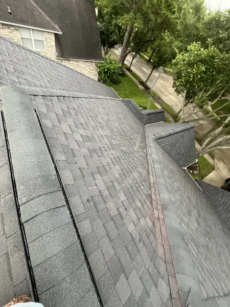Valley and ridge detail on a replaced roof in Houston, TX