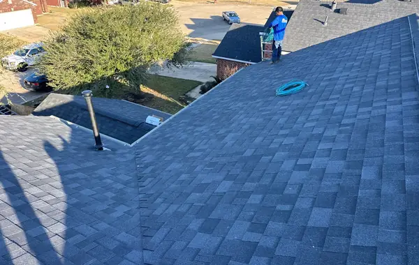 Steep front gable with fresh shingles on a February 2026 Houston roof