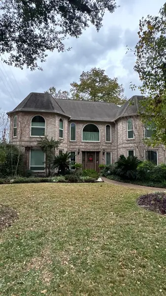 Two-story brick Houston home with a new 50-square shingle roof in 77095