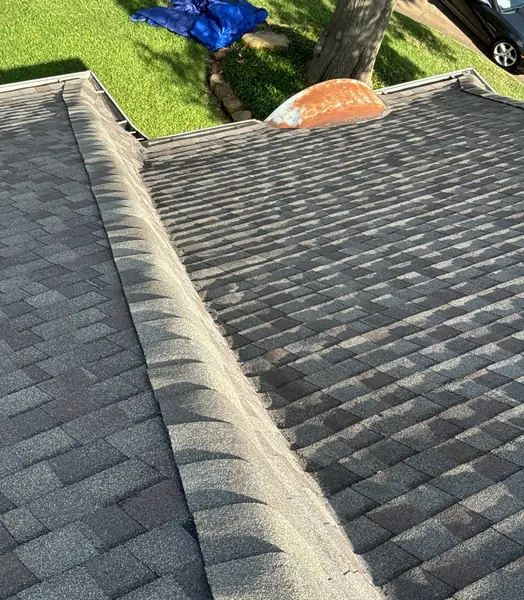 Side slope of a replaced roof with new gutters in Houston