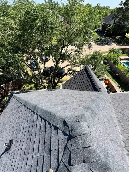 Steep hip ridge of an April 2025 roof replacement in west Houston
