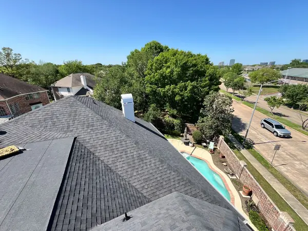 Chimney counter flashing on a new laminate roof in west Houston