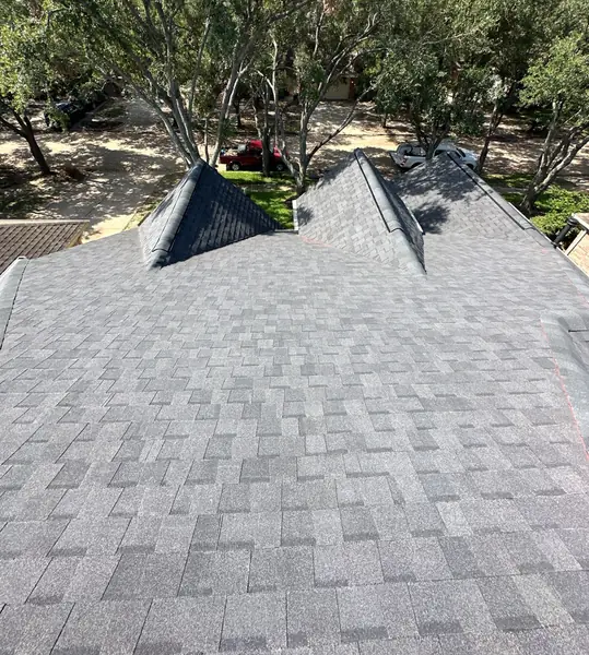 Replaced charcoal shingle roof with multiple hips on a Houston home in 77041