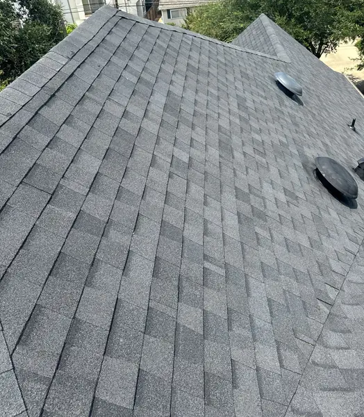 Gray laminate roof on a two-story Houston home in 77005