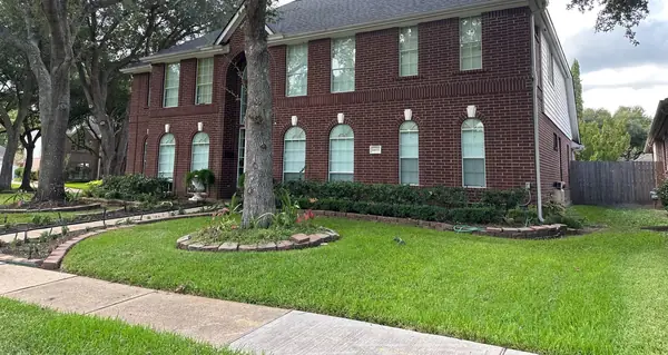 Two-story brick Richmond home in 77406 with a new charcoal laminate roof