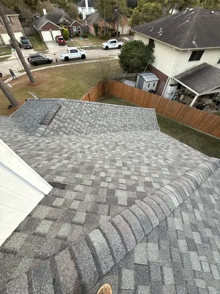 Rear slope of the completed roof with the neighborhood beyond