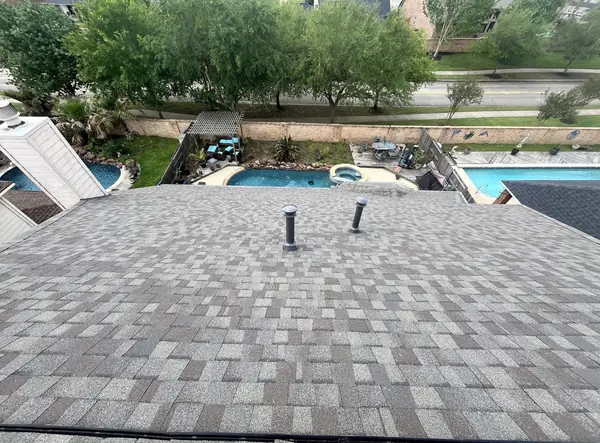 Brick chimney re-flashed on a new League City, TX roof