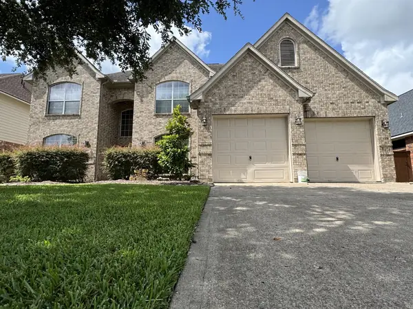 Two-story League City home in 77573 with a new Weatherwood laminate roof