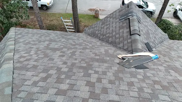 Rebuilt chimney cricket on a new Kingwood, TX roof