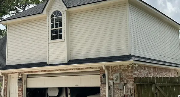 Dormer and garage roof on the completed replacement