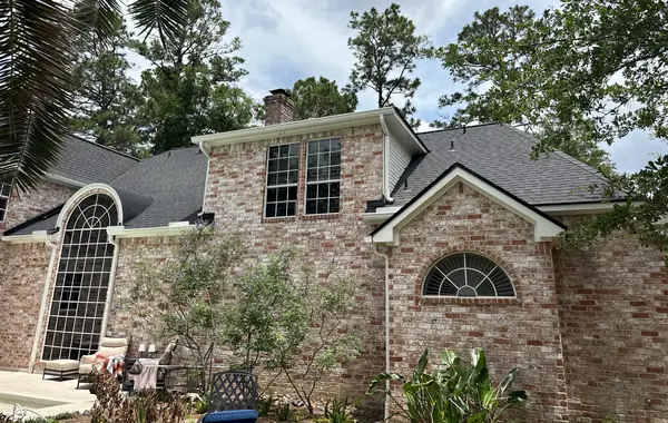Rear gable and arched window under the new roof
