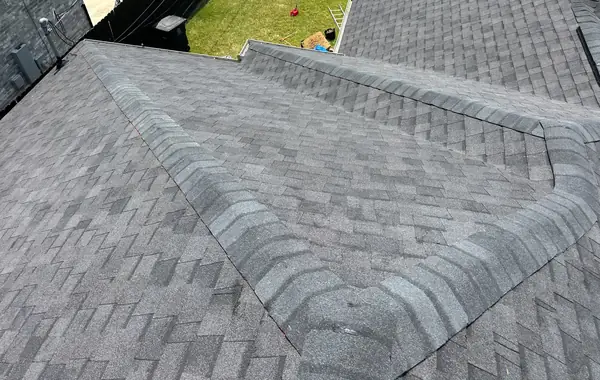 Hip detail and ridge cap on the finished roof, Houston 77051