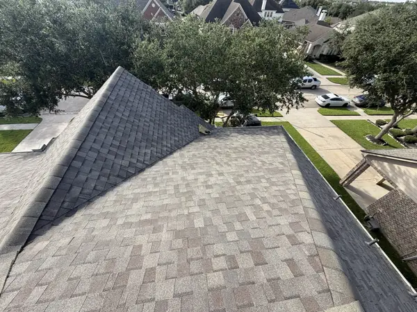 Hip slope of a Weathered Wood shingle roof in southeast Houston