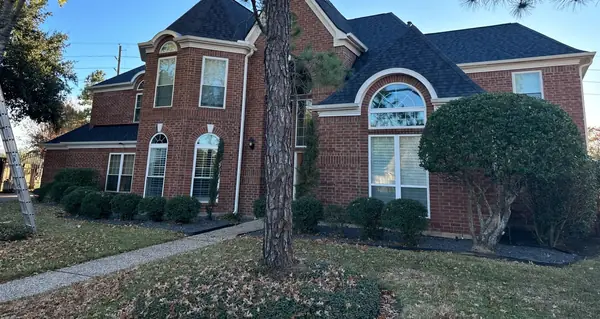 Front of a two-story Houston home with a 68-square roof