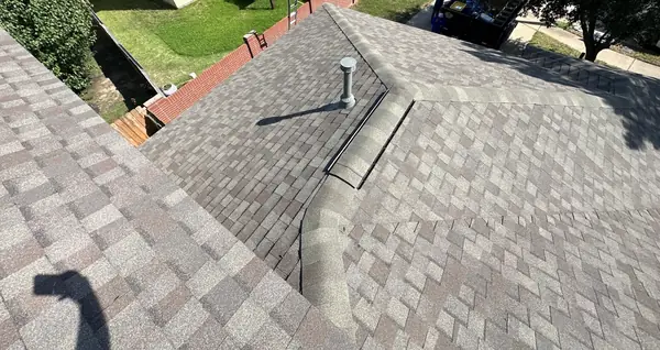 Hip and ridge caps on the completed roof, Cypress 77433