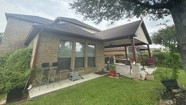 Covered patio with the new roof tying into the main hip