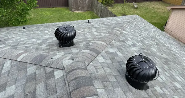 Turbine vent and hip ridge on a replaced roof in northwest Houston