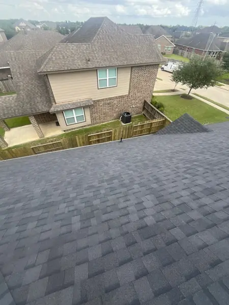 Completed roof of a two-story brick home in southeast Houston