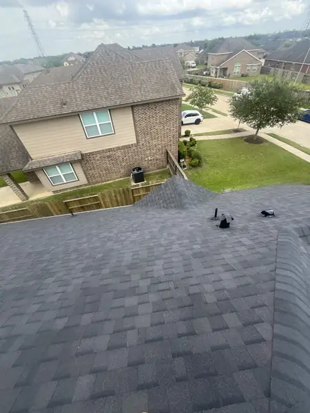 Roof slope above the driveway with new ridge caps