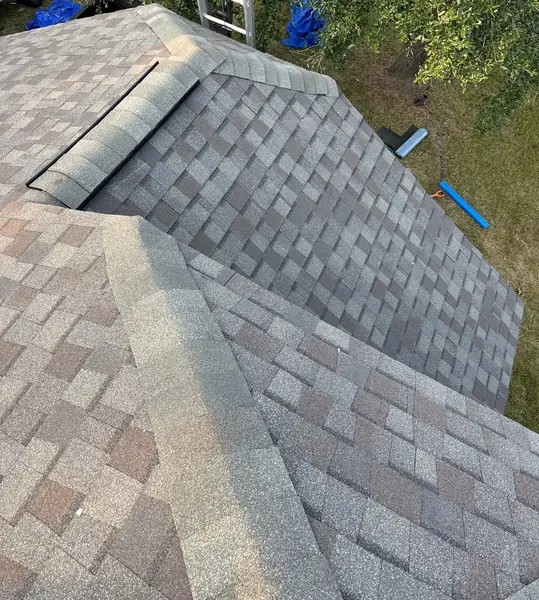 Hand-nailed CertainTeed roof with capped hips on a Manvel home in 77578