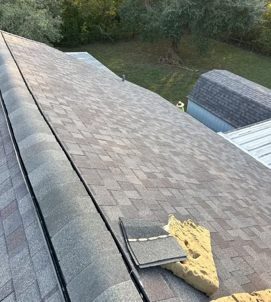 Backyard shed roofed to match the main house in Manvel