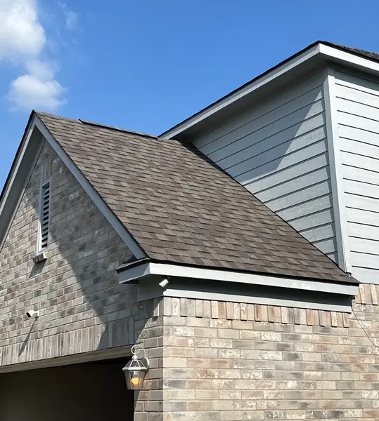 New charcoal laminate roof on a two-story Houston home in 77049