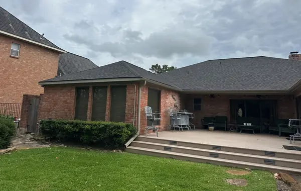 Brick chimney on a replaced roof in Quail Valley