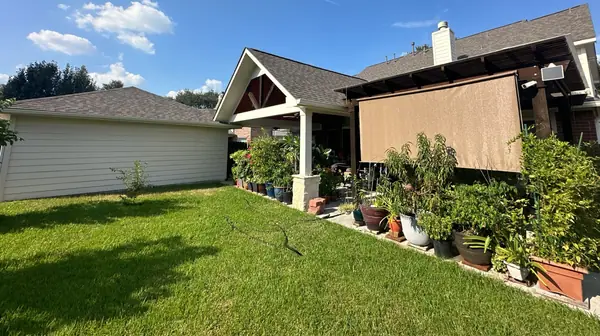 Patio roof and main roof after an October 2025 replacement in Houston 77040