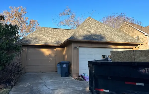 Garage gable with fresh shingles on a March 2026 Richmond, TX roof
