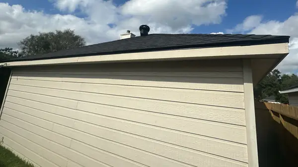 Rear siding and new roof edge on a two-story Houston home