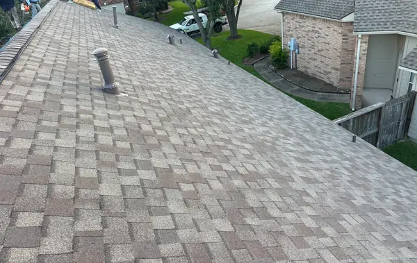 Driftwood laminate roof on a two-story Pearland home in 77581